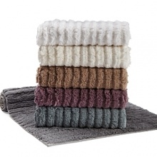 Ribbed bath rug in assorted colors.