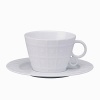 Modern in design with a raised circular pattern, made from French Limoges Porcelain. Dishwasher and microwave safe.