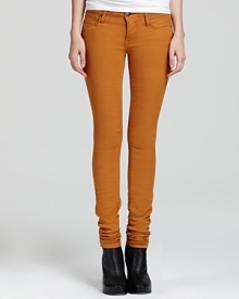 A forward take on the essential skinny, these Helmut Lang pants tout unexpected knee seams in a rich mustard hue.