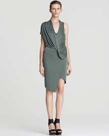 From coffee with clients to cocktails with friends, this Helmut Lang dress delivers. A practice in asymmetry, the silhouette appears to wrap across your bodice, draping at the front, but, in fact, the style is in the detail. Continue the modernity with chunky sandals and tough-luxe accents.