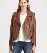 Buttery lambskin leather jacket with motorcycle-inspired details and major it-girl vibes. Notched collarSnap closuresEpauletsLong sleeves with zip cuffsFront zipperZippered slash pocketsFlap pocketsBelted hemAbout 21 from shoulder to hemLeatherDry clean with leather specialistImportedSIZE & FITModel shown is 5'10 (177cm) wearing US size Small. 