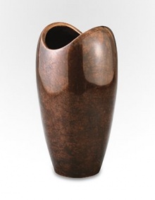 The rounded shape of this handcrafted vase has classic appeal whether you're given to a single bud, a well-edited bouquet or a wild bunch of flowers. And its bronze-finish alloy is a refreshing change from more traditional glass silhouettes. From the Heritage Pebble CollectionAntique copper-plated alloy10H X 5¼ diam.Wipe cleanImported