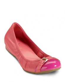 Buckled down elegance in a ballet flat with cap toe detail. From Cole Haan.