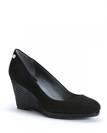 Snake up your look on embossed wedges and add sophisticated edge to your basic footwear wardrobe; by Calvin Klein.