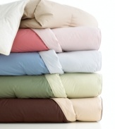 Get two looks with one comforter! This Sealy® reversible comforter allows you to change up the look of your room with ease. Made of 300-thread count cotton and down fill for superior comfort and warmth. Comes in five colors. (Clearance)