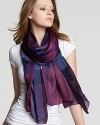 A luxurious silk scarf shows off the iconic Burberry check in deep purples and lovely violets.