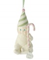 Commemorate your little one's first Christmas with this adorable Snowbabies Baby's First Christmas Ornament from Department 56. Crafted of pure porcelain bisque and accented with green, pink and white sparkles.