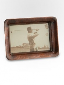 A must-have addition to your collection is handcrafted in antiqued copper plating, lending a timeworn touch to a cherished photo. Accommodates a 4 X 6 photograph Antique copper plating Wipe clean Imported 