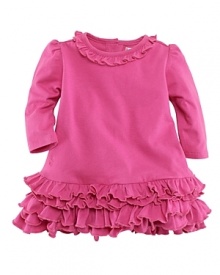 An adorable dress is accented with tiers of ruffles for a girly look.