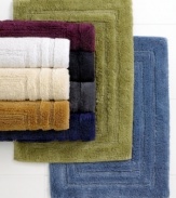 Treat your feet with these these plush bath rugs from Lauren by Ralph Lauren, featuring ringspun cotton and viscose fiber from bamboo and a triple racetrack design. Choose from a variety of colors to complement any bath décor.