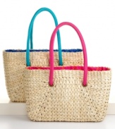 Carry all your provisions for a day at the beach in a stylish tote woven of natural rush. Vibrant poplin lining adds a splash of summer color and gives the classic style of the bag a fresh, modern accent.