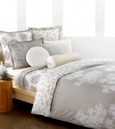 The Snow Willow duvet cover set captures the beauty of winter in neutral colors fit for all seasons. Scattered white branches grow across a muted, geometric design while the reverse presents a collection of these branches in calming color.