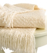 Beat the cold with this super-soft throw from Lauren by Ralph Lauren. Features a boucle knit in a cream hue for a cozy addition anywhere in your home. Finished with a 3 fringe.