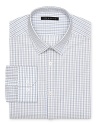 An easy-going check pattern adorns this refined dress shirt that transitions well from day to evening.