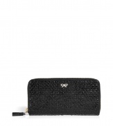 Add instant luxe to the everyday with this woven leather wallet from cult favorite Anya Hindmarch - Classic rectangular shape, top zip closure, front log detail, inside card slots and bill fold - Perfect for everyday use or as a thoughtful gift