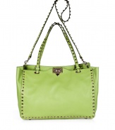 Radiate Valentinos covetable-chic look with this bright apple green rockstud adorned tote - Embossed logo, double top handles, removable shoulder strap, platinum-toned rockstud trim and hardware, hinged top closure inside zippered back wall pocket, two front wall slot pockets, protective feet - Carry as an immaculate polish to bright print dresses or elevated jeans-and-tee ensembles