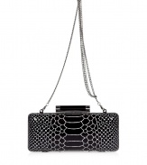 Chic clutch in fine, black leather - Elegant, on-trend python look - Rectangular box shape with contrasting hardware - Practical hard-shell design - Removable silver chain link strap - Tubular detail at snap closure - Versatile and polished, a must for cocktails, dinners and parties - Roomy enough to fit all of the evening essentials