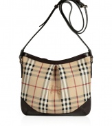 Work an iconic note into your handbag collection with Burberry Londons characteristic checked crossbody bag, perfect for stashing away work and weekend essentials alike - Top zip, logo hardware, belted shoulder strap, inside zippered back wall pocket - Pair with bright knits and favorite skinnies