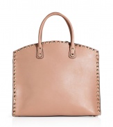 Iconic and exquisite with its pristine noisette calfskin, Valentinos rockstud trimmed tote counts as a luxe must for sophisticated looks - Rockstud trim, two-way top zip, embossed logo, inside zippered back wall pocket, two front wall slot pockets - The perfectly luxe polish to sleek tailored looks