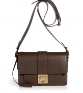 Invest in classic sophisticated style with Salvatore Ferragamos luxurious dark brown leather crossbody bag - Boxy shape, front flap with gold-tone Gancini logo lock closure, buckled crossbody strap, inside front sectional pocket, zippered back wall pocket, leather lining - Perfect for off-duty chic or elegant workweek style