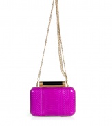 Hard-edge elegance gets an impossibly luxe twist in Diane von Furstenbergs petite clutch, finished to perfection in flawless fuchsia snakeskin - Metal frame, hinged top closure, removable chain-link shoulder-strap, inside back wall slot pocket - Pair with cocktail dresses and statement pumps