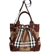 Whether paired with casual looks or an early evening cocktail ensemble, make a bold statement in this luxe, logo-laden tote from Burberry London - Classic carryall style, leather carrying handles and convertible shoulder strap, leather trim detailing and multiple straps, logo printed body, metal feet at bottom, multiple internal pockets- Perfect for daily use or off-duty chic