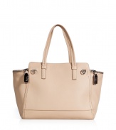 With its pristine almond leather and cleverly designed locked side pockets, Salvatore Ferragamos oversized tote is an exquisitely chic take on this multi-season style - Double top handles, zippered curved side pockets with hinged logo lock closures, zippered top panel, extra roomy interior, inside zippered back wall pocket, 2 front wall slot pockets, protective feet - Perfect for sleek city getaways or extra busy days at the office