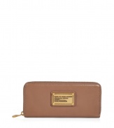 Stash away your most precious essentials in Marc by Marc Jacobs slim leather zip-around wallet, complete with an eye-catching logo plaque for a chic, covetable finish - Two inside sections with a zippered sectional coin pocket - Perfect for finishing sophisticated daytime looks