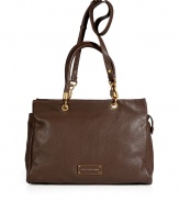 Undeniably chic, this classic tote from Marc by Marc Jacobs exudes ladylike style - Zippered top, front logo plaque, double top handles with gold-toned hardware, convertible shoulder strap, textured leather - Perfect for your casual-cool looks or off-duty chic