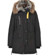 Bring undeniable style to your cold weather look with this rugged-cool fur lined parka from Parajumpers - Large raccoon and rabbit fur lined hood, long sleeves, multiple front pockets, ribbed cuffs, internal drawstring waist, slim fit, logo patch at shoulder, water resistant - Wear with jeans, a cashmere pullover, and boots