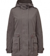 This elevated parka from Closed will keep you covered in style - Concealed front closure, hood with dual-button detail at neckline, drawstring waist, cargo waist pockets, belted cuffs - Wear with slim chinos or jeans, a slim pullover, and wedge heels