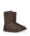 A true original and casually stylish go-to from Ugg, the classic chocolate short boot is a perennial must - Crafted from twin-faced sheepskin and featuring exposed seams, reinforced heel, traction outsole and signature Ugg label - Fleece-lined for superior warmth and comfort - Shorter, mid-calf height ideal for wearing under or over pants - Truly versatile, perfect for pairing with everything from skinny jeans to yoga pants to miniskirts