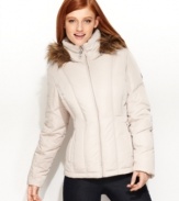 Streamlined vertical quilting gives Calvin Klein's short puffer coat a trim silhouette, while a faux-fur-trimmed hood adds a luxe touch.