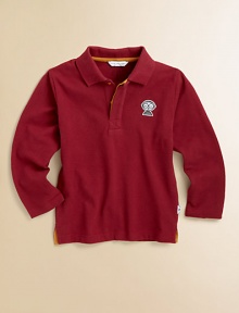 A classic long-sleeve polo with a signature touch, contrast twill trim and a Mister Marc appliqué on the chest.Ribbed polo collarHidden button placket with contrast trimChest appliquéLong sleeves with sewn hemsEven side-split hemCottonMachine washImported Please note: Number of buttons may vary depending on size ordered. 