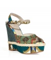 Inject quirky-cool style into your warm weather look with these luxe mixed print wedges from D&G Dolce & Gabbana - Peep-toe, ankle strap with buckle closure, woven-detailed wedge heel, all-over mixed print - Style with bohemian-inspired dresses or with an elevated jeans-and-tee ensemble