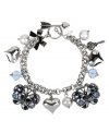 Spring from your cocoon this season! Betsey Johnson's darling toggle bracelet combines blue-crystal butterfly and  heart charms with blue faceted beads, glass pearls and metal accents. Set in rhodium-plated mixed metal. Approximate length: 7-1/2 inches.