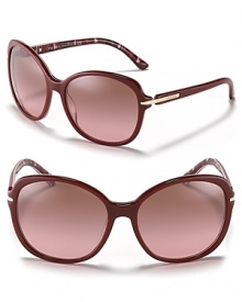 Glamorous round oversized sunglasses with a spotted interior for a stylish surprise.