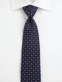 A fine silk tie featuring classic pointelle and the signature omega print.SilkDry cleanMade in Italy