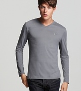 A clean-cut pima cotton v-neck tee with tonal embroidery at the left chest.