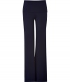 Sumptuously soft and effortlessly cool, Donna Karans pure, ink blue cashmere blend knit pants epitomize understated luxury - Crafted with a touch of flattering stretch material - Slim, medium-rise pull on style with fold-over waist - Bell cut flares gently at hem  - A must for chic off duty looks - Pair with cashmere pullovers,  button downs and tunic tops