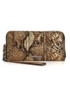 An eye-catching design from Kenneth Cole Reaction, featuring a fun python print and sleek metallic accents. An easy-access zip-around closure and convenient wristlet strap add function to this fashion-loving design.