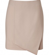 An ultra chic take on this workwear essential separate, Cacharels folded wool skirt guarantees an understated elegant polish to your look - Folded front with asymmetrical hemline, tonal grosgrain trim at side with hidden zip closure, double back vents - Softly tailored fit, mini-length - Team with everything from modern knits and ballerinas to feminine silk blouses and heels