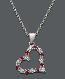 The perfect way to express your love. This open-cut heart pendant by Victoria Townsend features bright red rubies (1/3 ct. t.w.) and sparkling diamond accents set in sterling silver. Approximate length: 18 inches. Approximate drop: 7/8 inch.