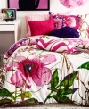 Wild and crazy. This Flora and Fauna comforter set from Teen Vogue features bright and bold florals embellished with an abstract splatter paint design. Comforter reverses to a pink and white zebra stripe pattern.