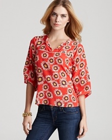 Delight in this daisy-printed silk Tucker blouse and inject warm-weather style into your current collection. A sure way to brighten your day, the silk top teams with jeans for a sunny weekend of looks.