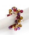 Dress up simple linens for a seasonal bash with napkin rings strung with sparkling beads. Shades of burgundy, violet and gold complete a memorable harvest table.