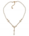 Stop and smell the flowers with this floral-designed necklace by Carolee. Glass and plastic pearls make a stunning statement with a plunging Y-shaped pendant embellished with glass stone accents. Crafted in gold tone mixed metal. Approximate length: 16 inches + 2-inch extender.