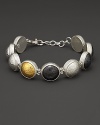 Bold amulets of white and black silver with 24K. yellow gold on a silver chain. From Gurhan.