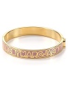 MARC BY MARC JACOBS lends it's signature stamp to this 12-karat gold plated bangle. Slip this piece on your wrist to give your bracelet stack a branded touch.