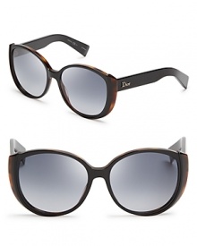 Leopard print underlines the cat in cat eye in these fashion-forward Dior sunglasses, featuring round, oversized lenses.